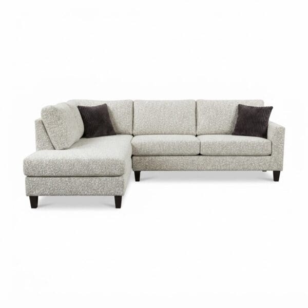 Custom made sofa sectional in beige fabric with brown pillows